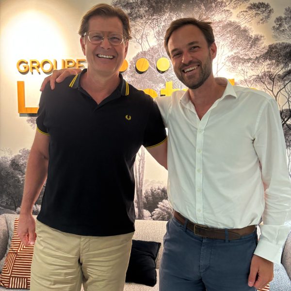Christian Gisy and Guillaume Henri smiling together at the La Centrale office in France.